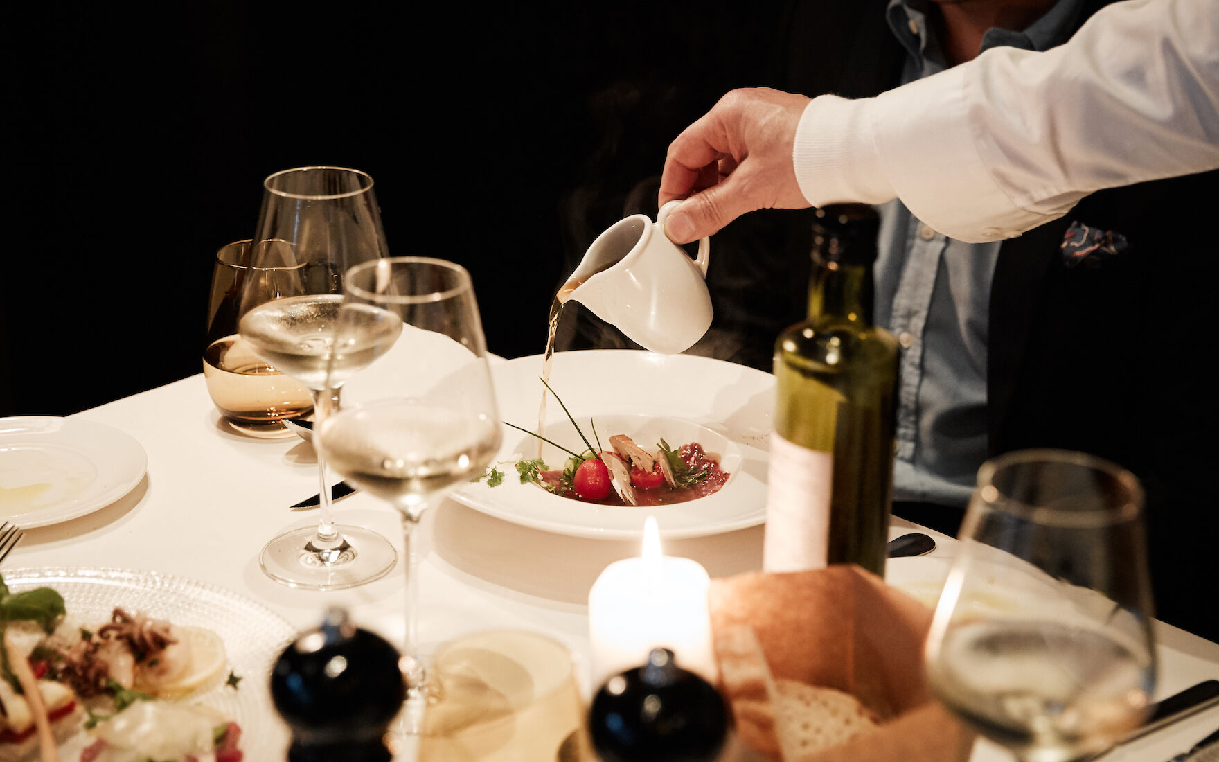 The George Hotel Hamburg Restaurant Dacaio food 24 Staff pouring broth over dish at DaCaio restaurant