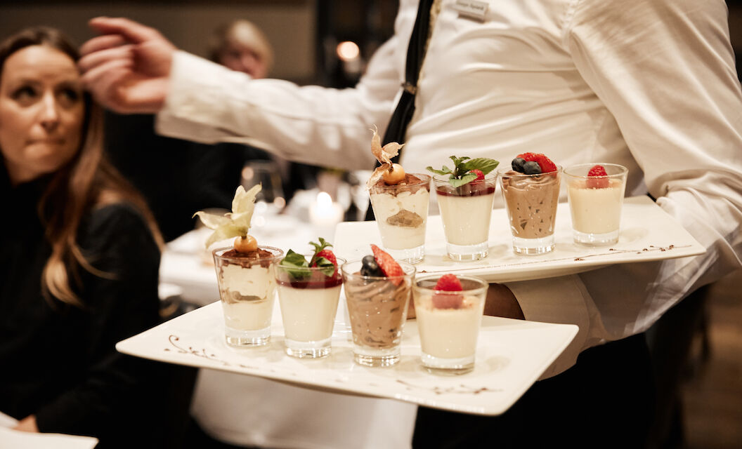 The George Hotel Hamburg Restaurant Dacaio food 58 Various desserts being served by staff at DaCaio
