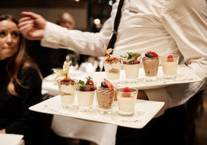 The George Hotel Hamburg Restaurant Dacaio food 58 Various desserts being served by staff at DaCaio