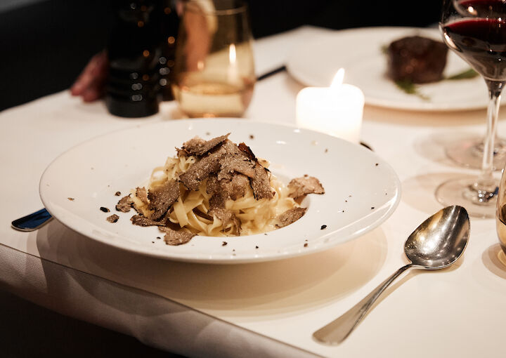 DaCaio restaurant table set with tagliatelle and truffle