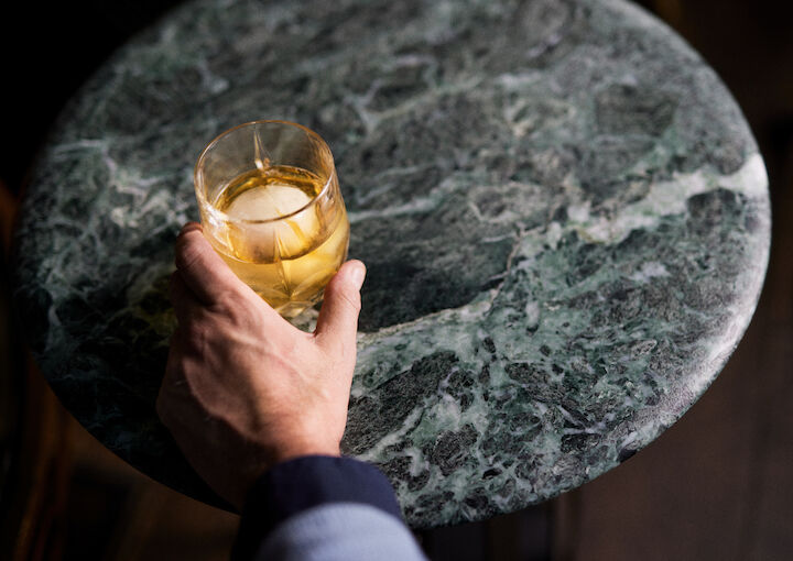 Close-up of whiskey on a marble side table