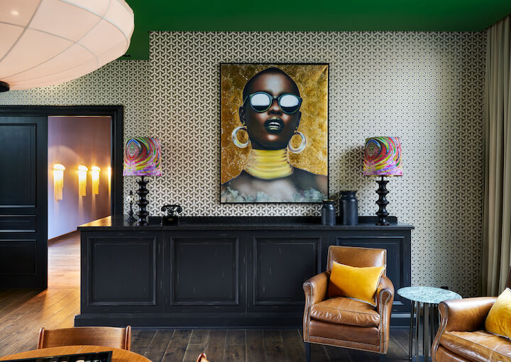 Private Library with leather chairs and large artwork on the wall
