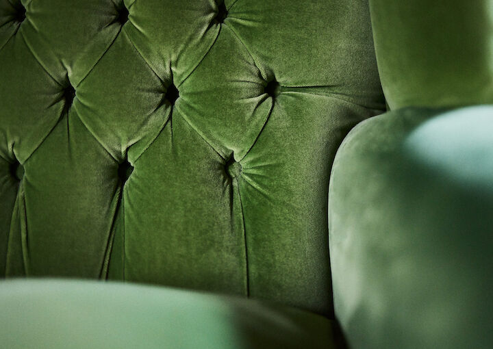 Close-up of a green armchair in Private Library