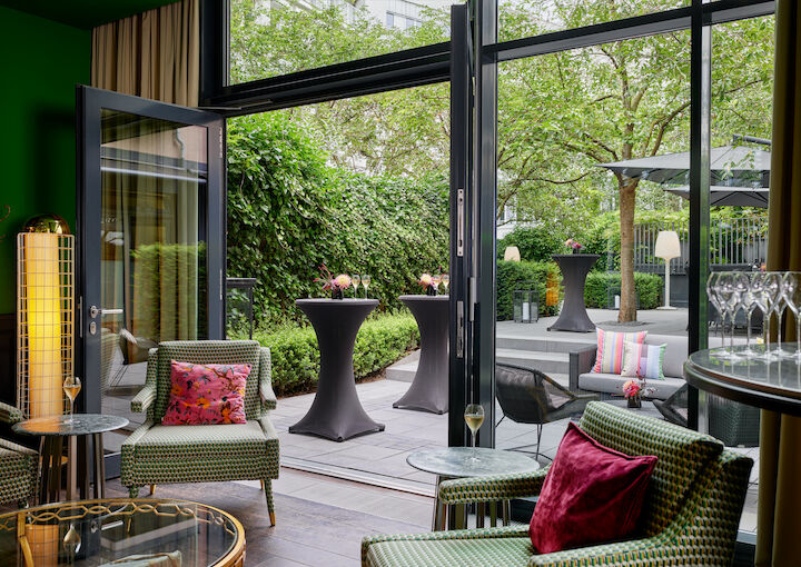 Cosy chairs near patio door opening onto the garden