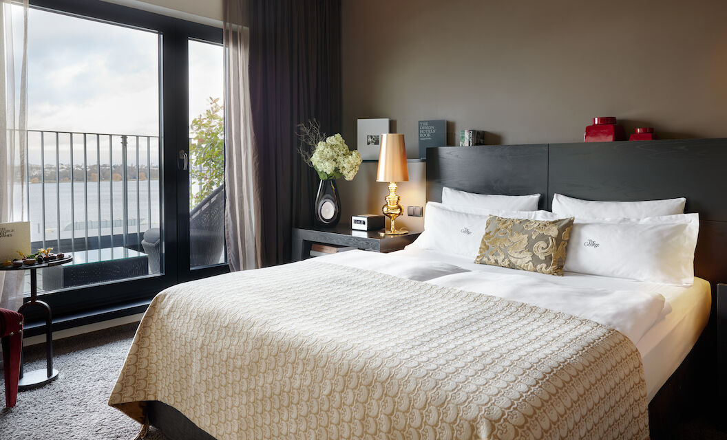 The George Suite with bed and large glass door to Alster view