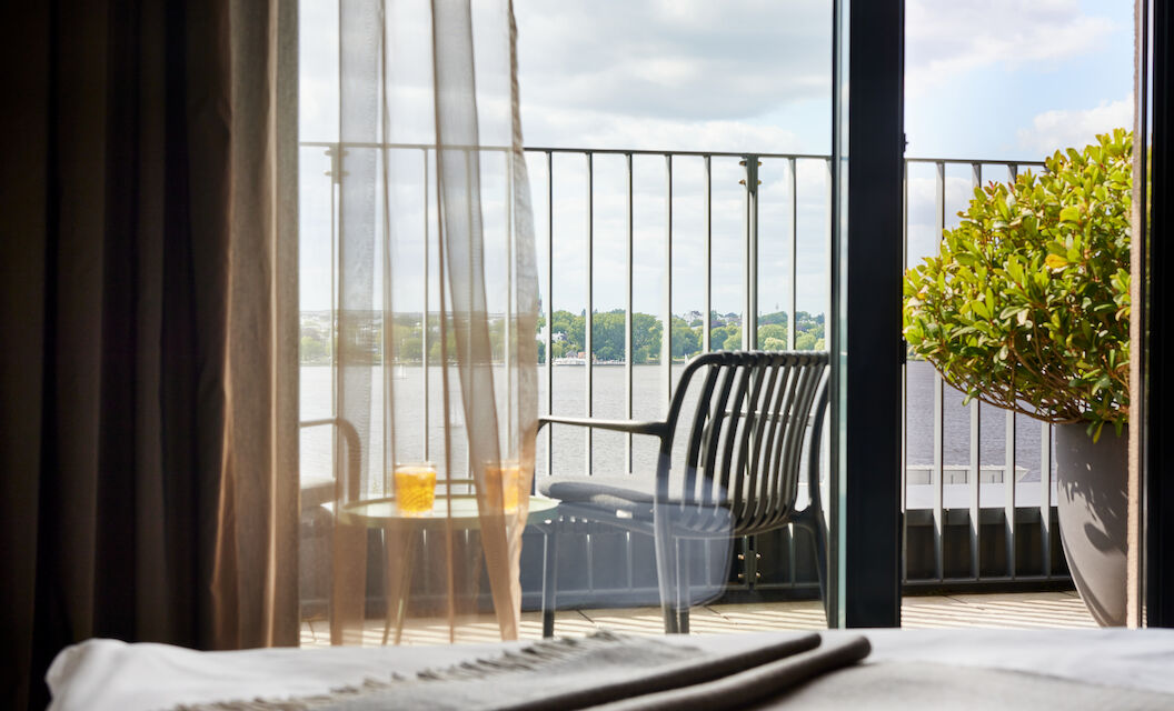 View from balcony with furniture towards the Outer Alster