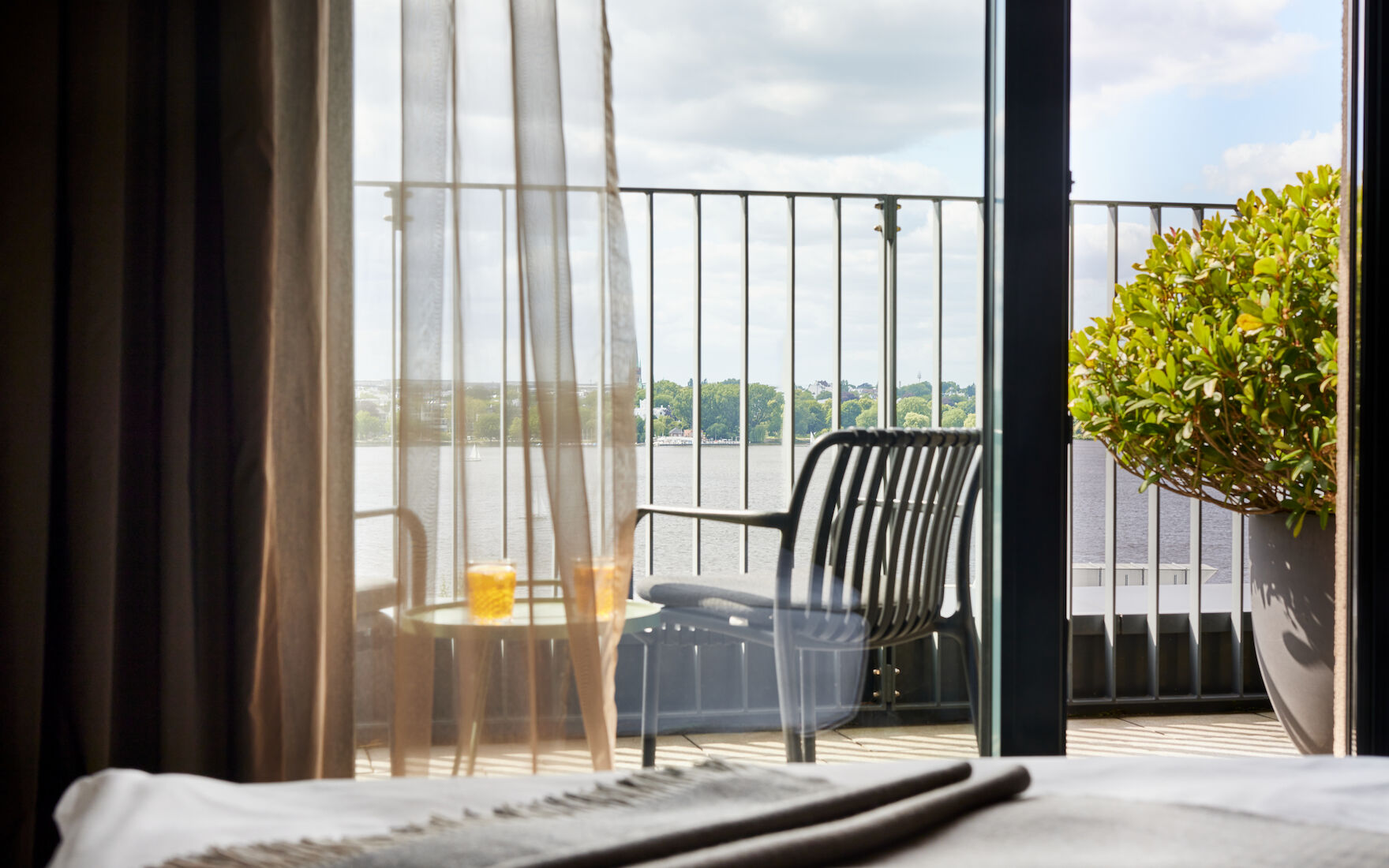 View from balcony with furniture towards the Outer Alster