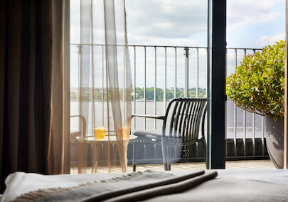 View from balcony with furniture towards the Outer Alster